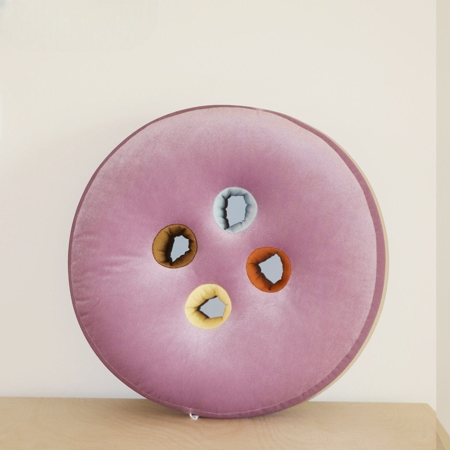 HOMELIVY round velvet seat cushion in lilac with four colorful button inserts: brown, yellow, orange, and light blue.