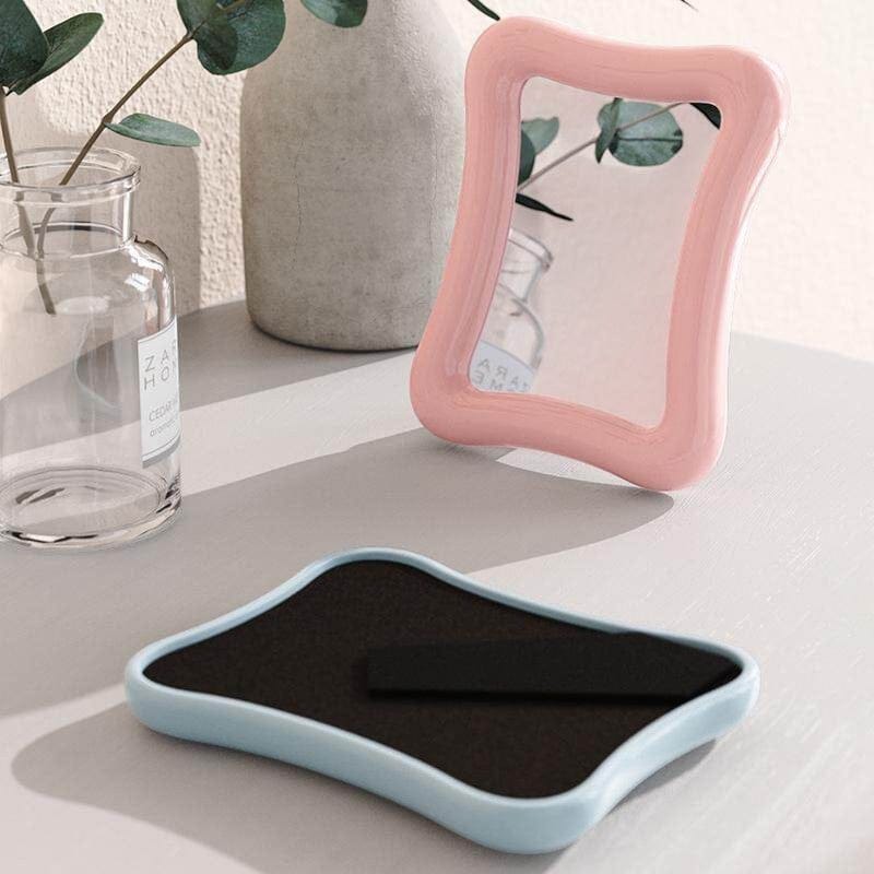 HOMELIVY pink wavy desk mirror with a glossy finish and clear reflective surface, 15 x 18cm.