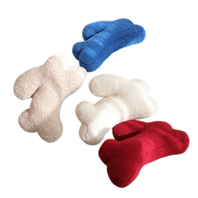 HOMELIVY plush bone-shaped throw pillows in cream, white, red, and blue. Soft, cozy decor for kids' rooms or living spaces.