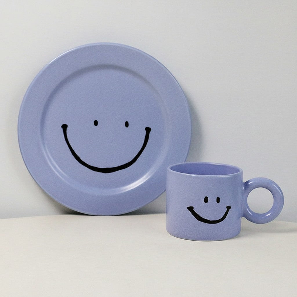HOMELIVY light purple ceramic mug and plate set featuring a black hand-drawn smiley face design