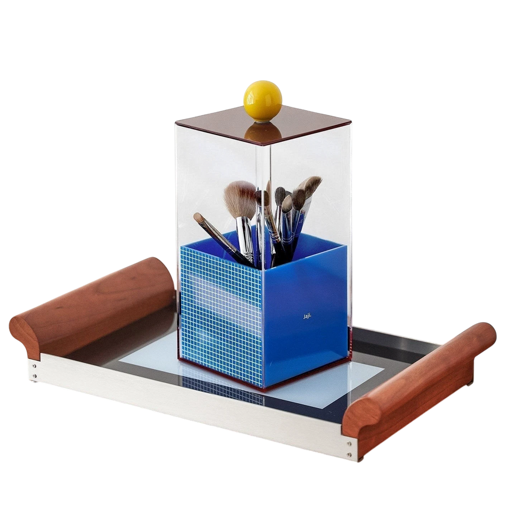 HOMELIVY Quirky Memphis acrylic brush holder with blue mosaic base and yellow knob on a wooden tray.