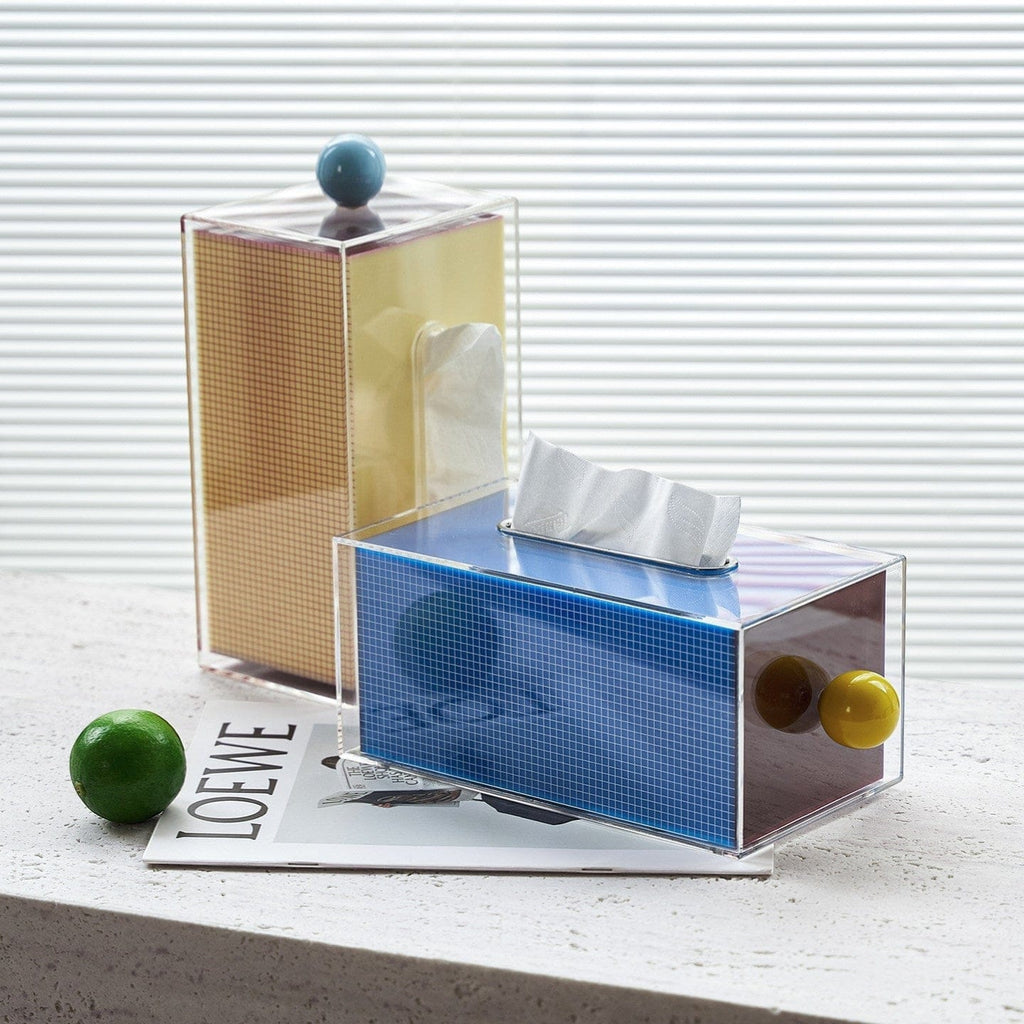 HOMELIVY retro acrylic tissue box holder with blue grid, yellow knob, and tan grid detail. Memphis-style design.