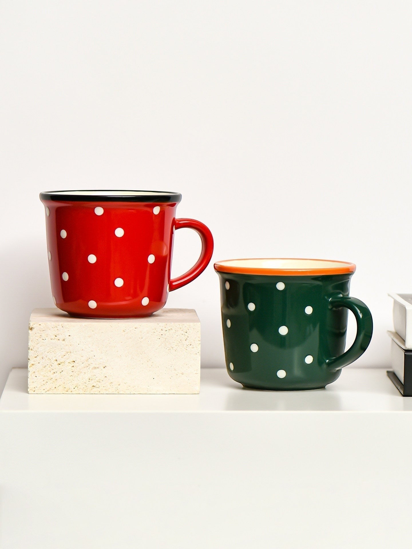HOMELIVY retro ceramic mugs in red and green with white polka dots and contrasting rims on a shelf.