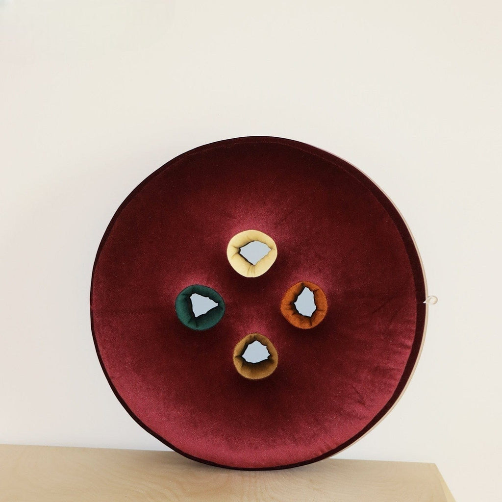 HOMELIVY round burgundy velvet seat cushion with four colorful button inserts: yellow, green, orange, and brown.