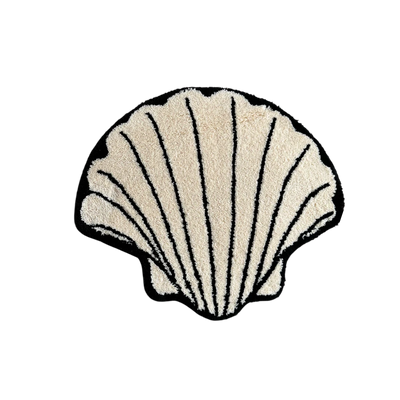 HOMELIVY cream shell-shaped rug with black outline and ribbed texture. Coastal decor.