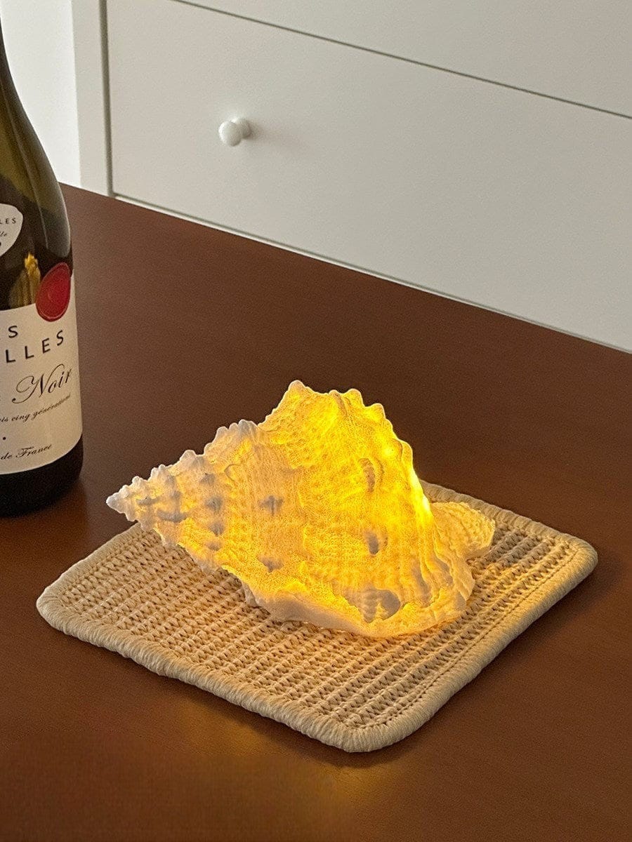 HOMELIVY decorative seashell LED light with warm yellow glow, battery powered for portable use.