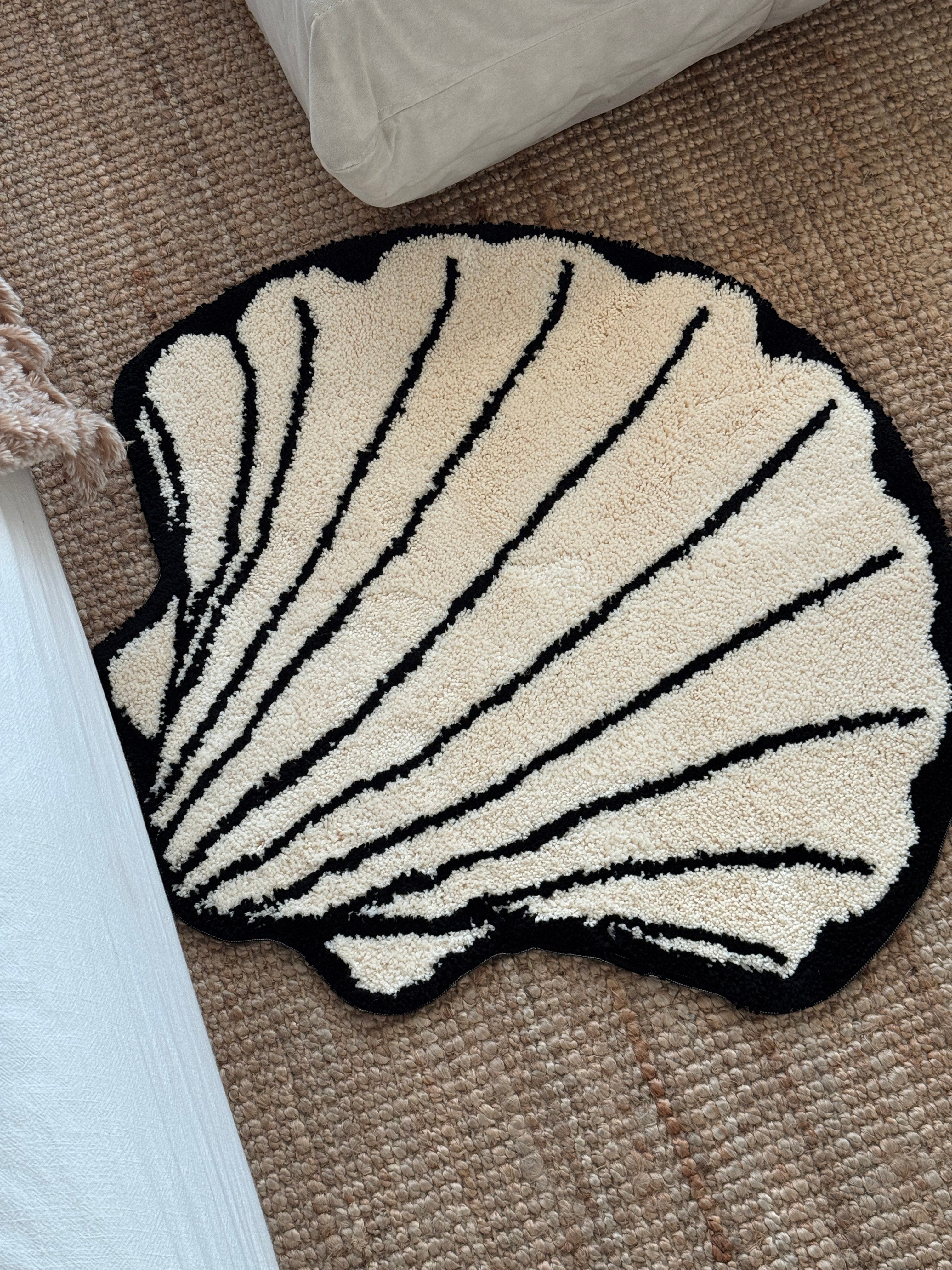 HOMELIVY funky rugs - cream shell-shaped rug with black trim and stripes,