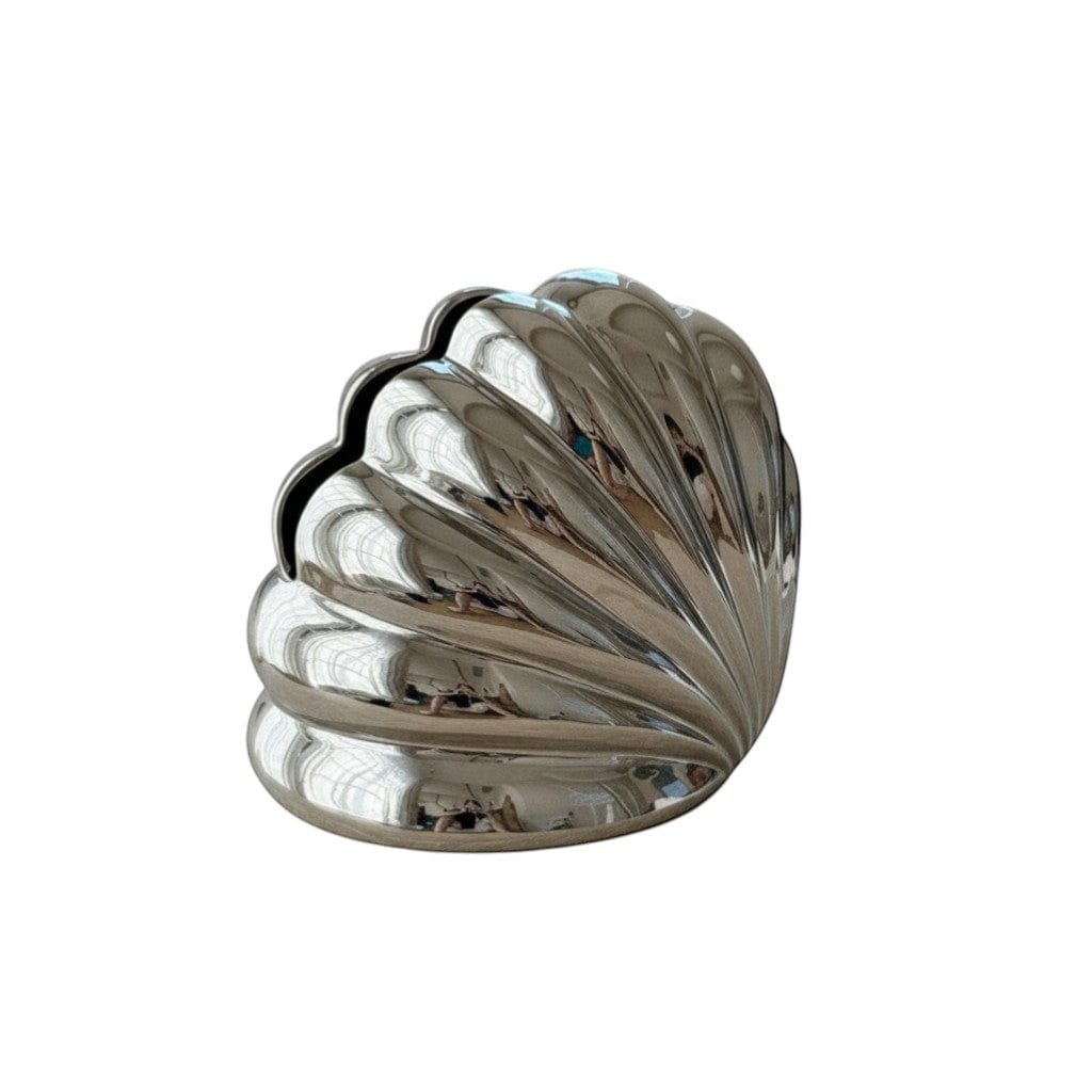 Shiny silver metallic seashell-shaped shell tissue holder bookend with polished surface and ridged contours
