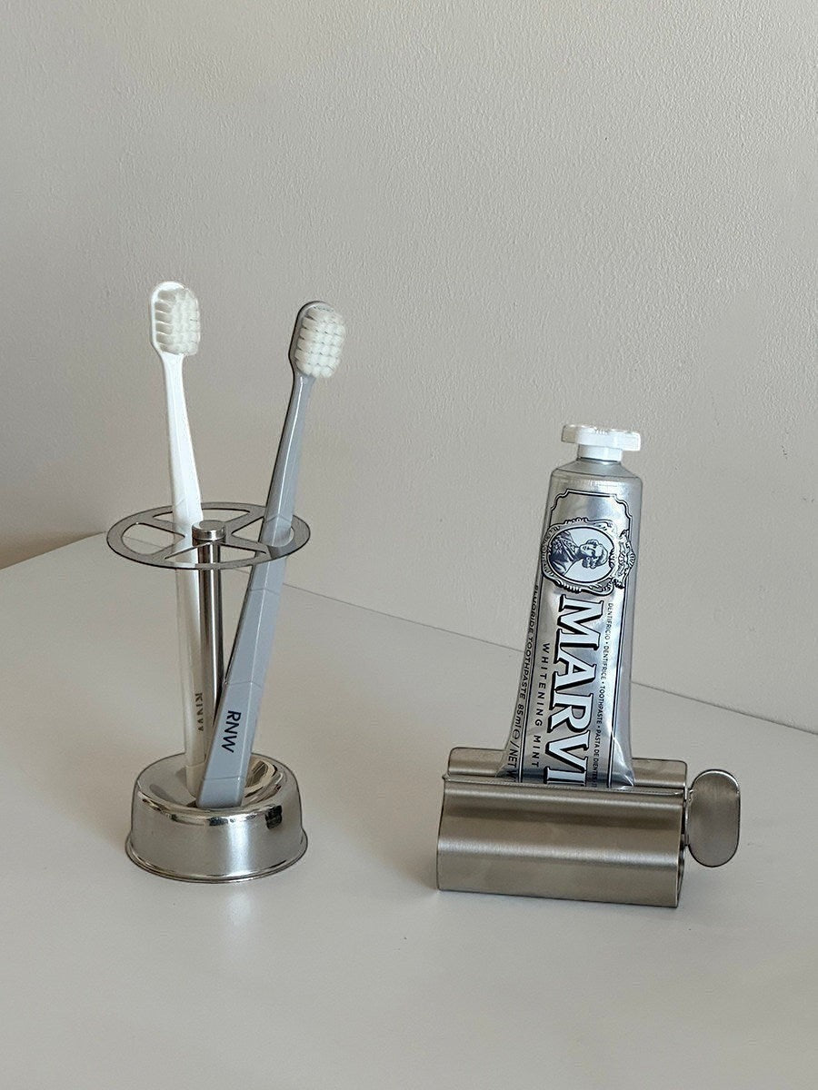 Silver stainless steel toothbrush holder and toothpaste squeezer