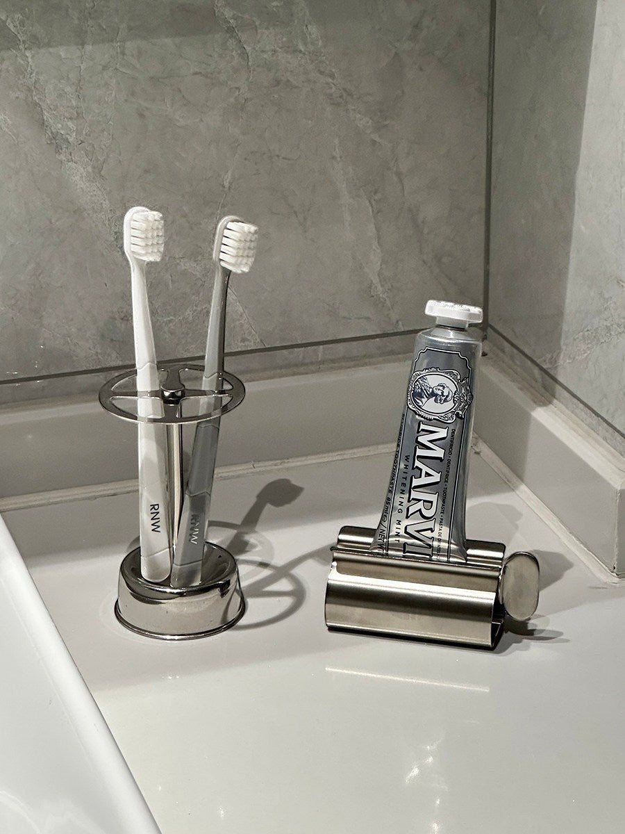 Silver stainless steel toothbrush holder and toothpaste squeezer