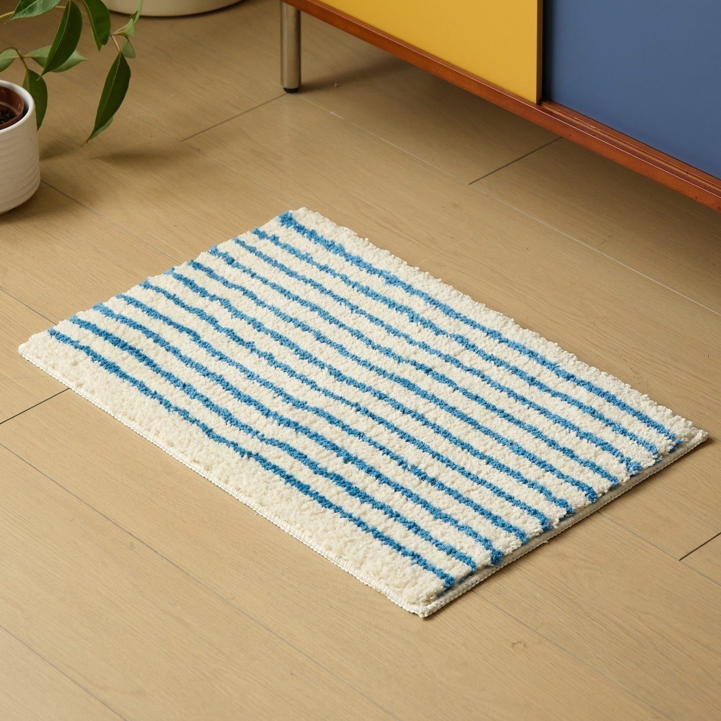 HOMELIVY minimalist striped bath mat rug in white with blue stripes, soft absorbent material
