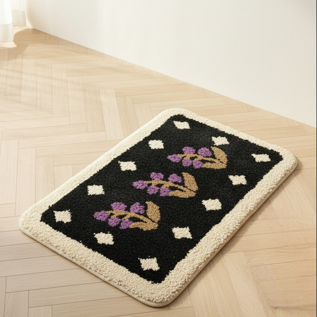 HOMELIVY vintage floral bath mat in black with purple flowers and cream border. Soft plush texture.
