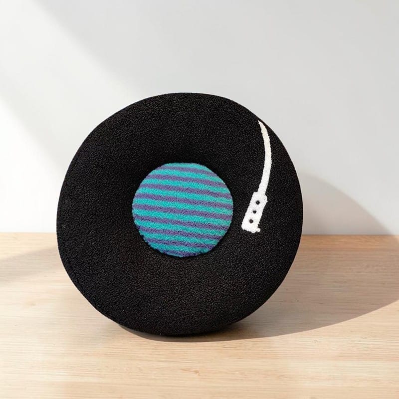 HOMELIVY black vinyl record throw pillow with turquoise and purple striped center label and white detail.
