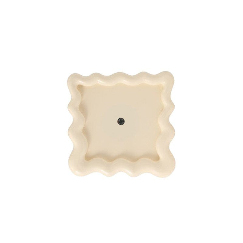 HOMELIVY wavy ceramic tray in cream, perfect for organizing jewelry or decor.