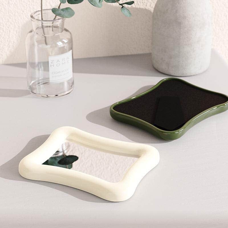 HOMELIVY wavy desk mirror in cream with a glossy finish and clear reflective surface.