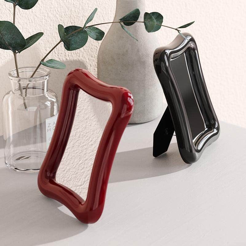 HOMELIVY wavy desk mirror in glossy red and black finishes. Decorative tabletop mirror.