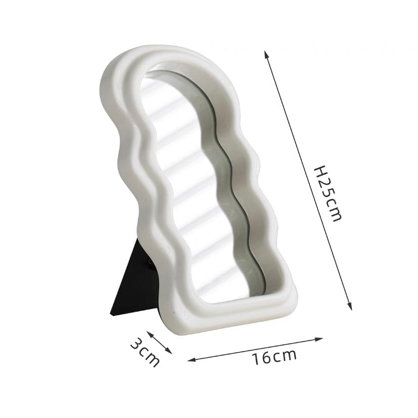 White ceramic table squiggly mirror with wavy sculpted frame and black triangular stand