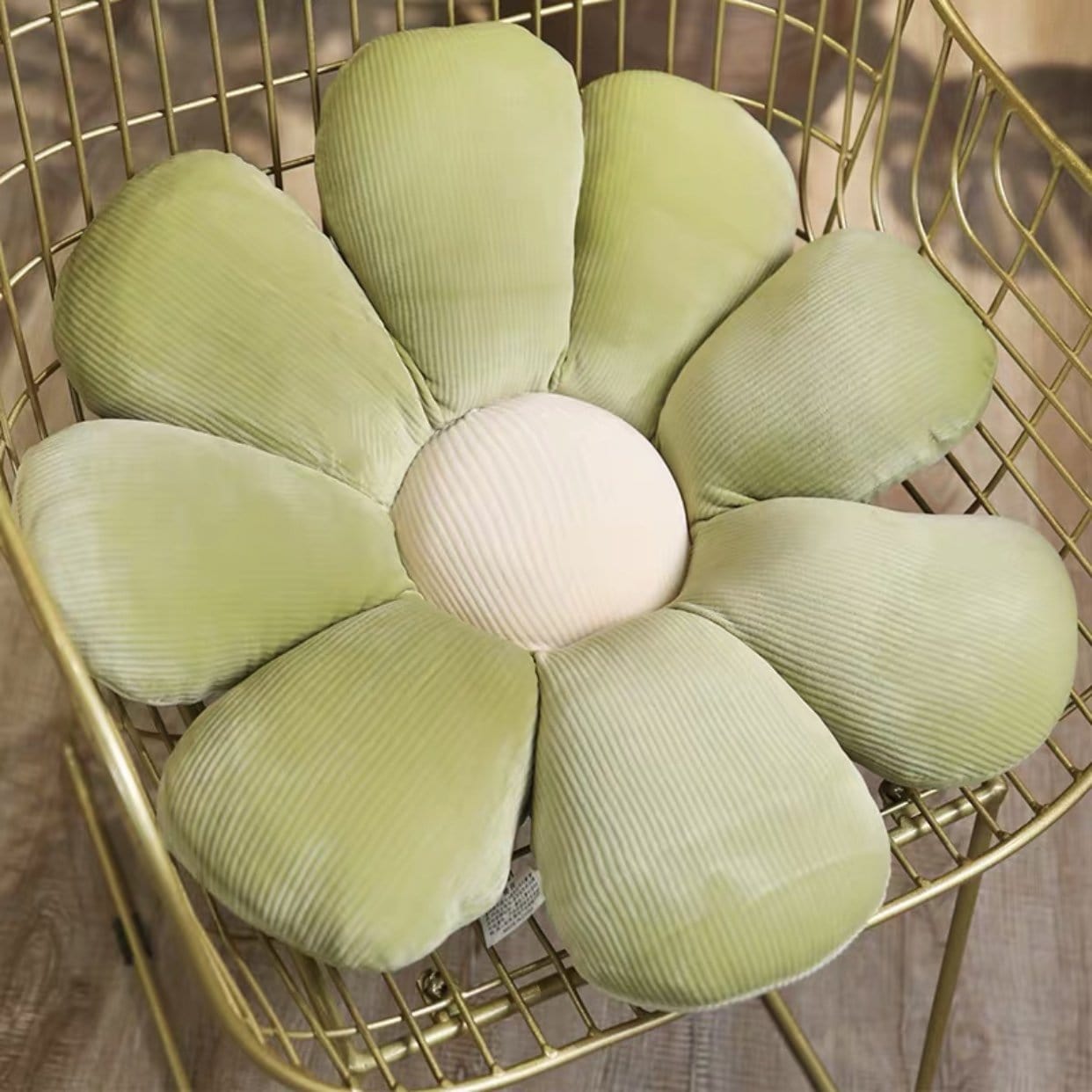 Pastel flower cushion a soft light green corduroy flower shaped cushion with cream colored center for decor