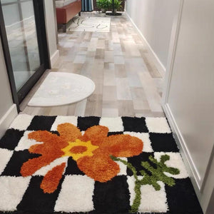 checkered orange flower rug
