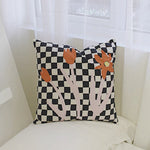 Load image into Gallery viewer, black and white checkered throw pillow with abstract flowers
