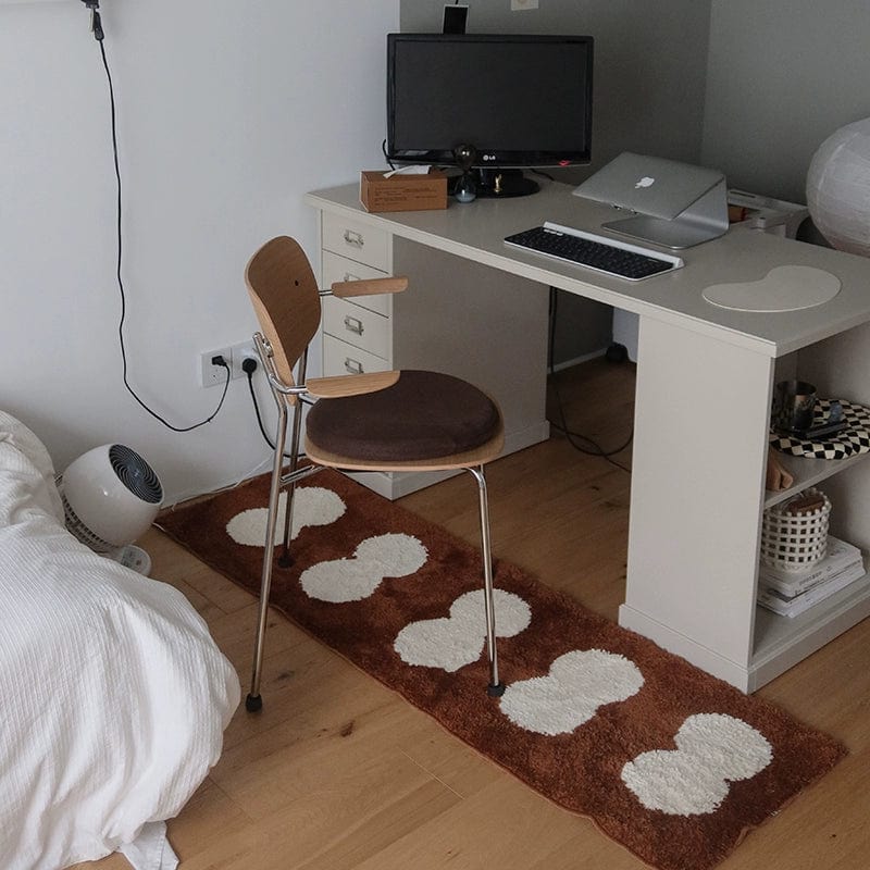 Minimal runner rug featuring a brown base with white cloud-shaped patterns for modern home decor