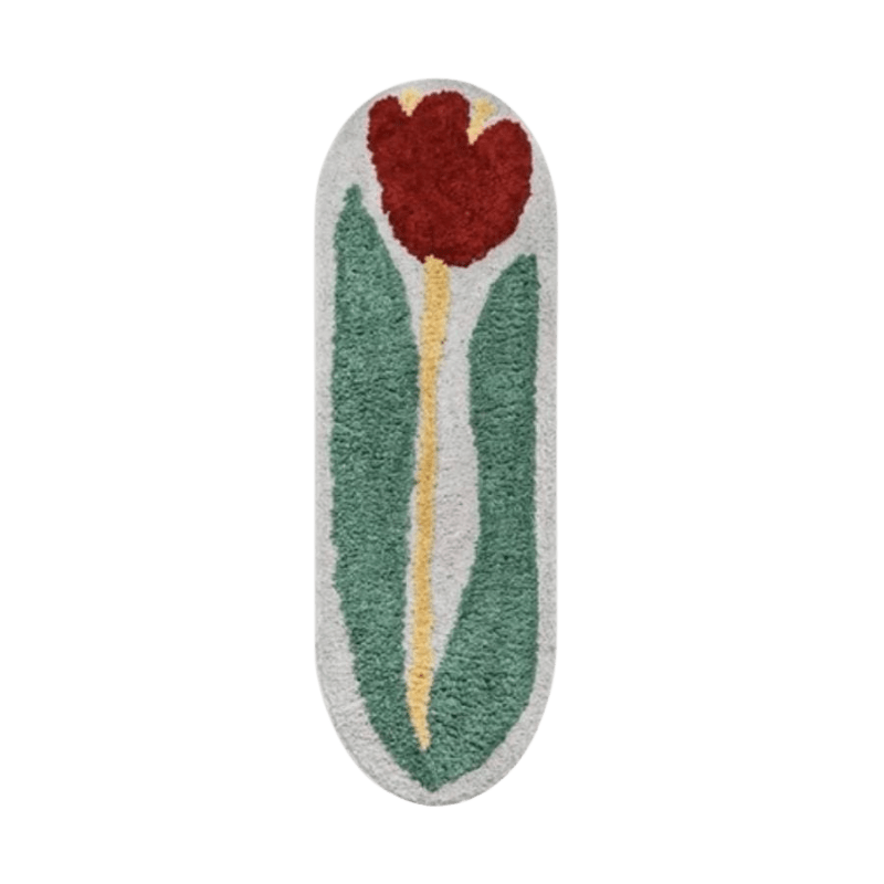 A plush red rose flower rug bath mat with a vibrant red tulip and green leaves on a soft white background
