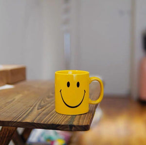 Yellow smiley face mug