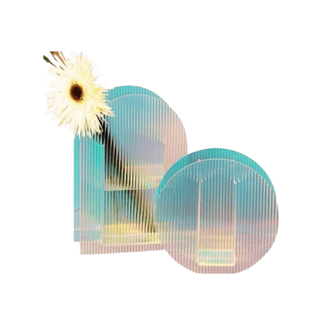 Iridescent arch flower vases in ribbed glass with soft teal and pink hues, one holding a white daisy