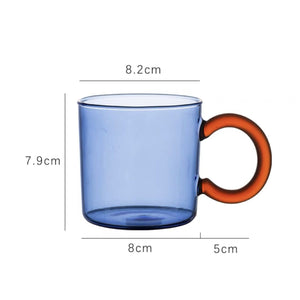 blue colored glass transparent mug cup