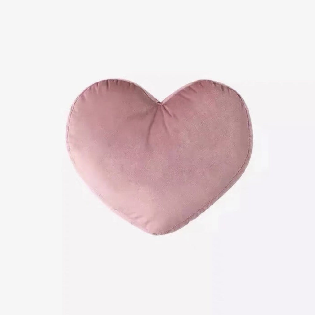 A soft blush pink heart-shaped plush velvet geometry pillow perfect for cozy home decor and comfort