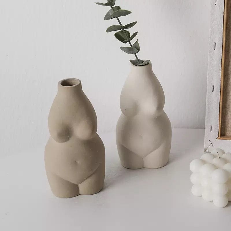 nude female body form flower vases