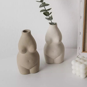 nude female body form flower vases