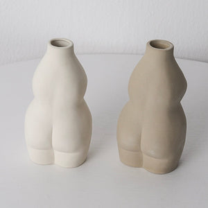 nude female body form vases