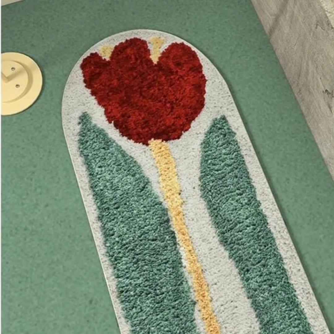 Red rose flower rug is a plush arched bath mat with a vibrant red tulip design made from soft textured yarn