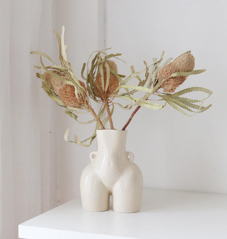 white ceramic butt vase, bum vase